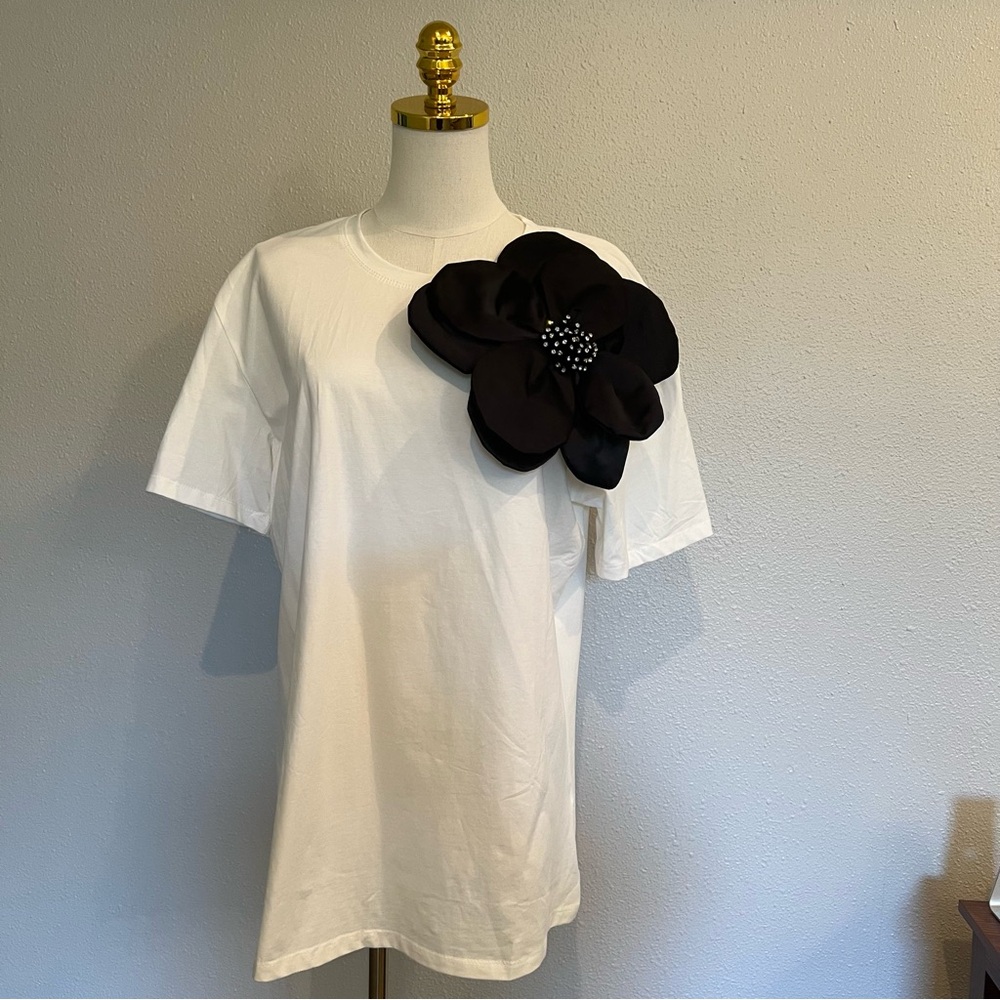 White T-Shirt with Black Flower Accent